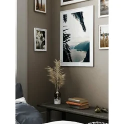 Poster Gallerix Between Palm Leaves